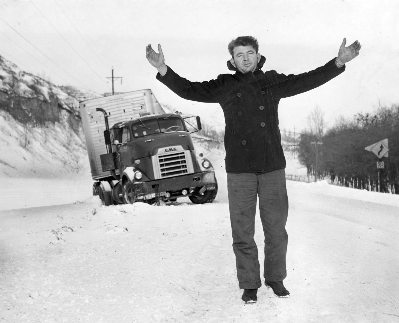 Dallas Morris, a truck driver from St. Petersburg florida thinks Iowa's winters for the birds. His truck spun off Highway 34 north of Glenwood and he spent the night in the cab waiting for snowplows to fee his truck. Published Feb. 10, 1949.